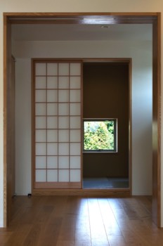 Japanese room sliding doors and window screens open.   Japanese room sliding doors and window screens open.